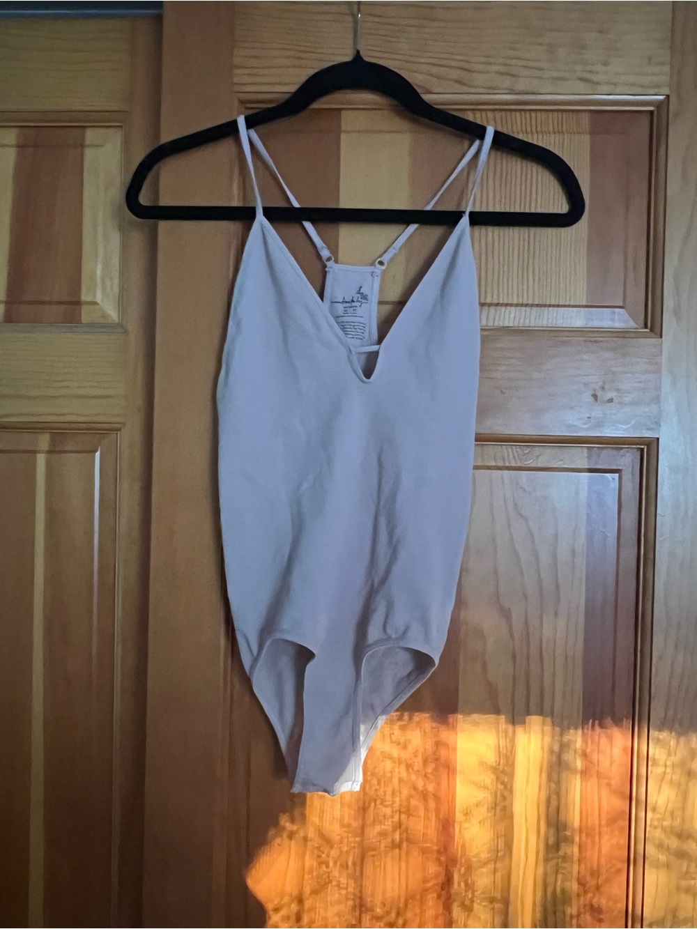 Free People Light pink V-Neck Bodysuit